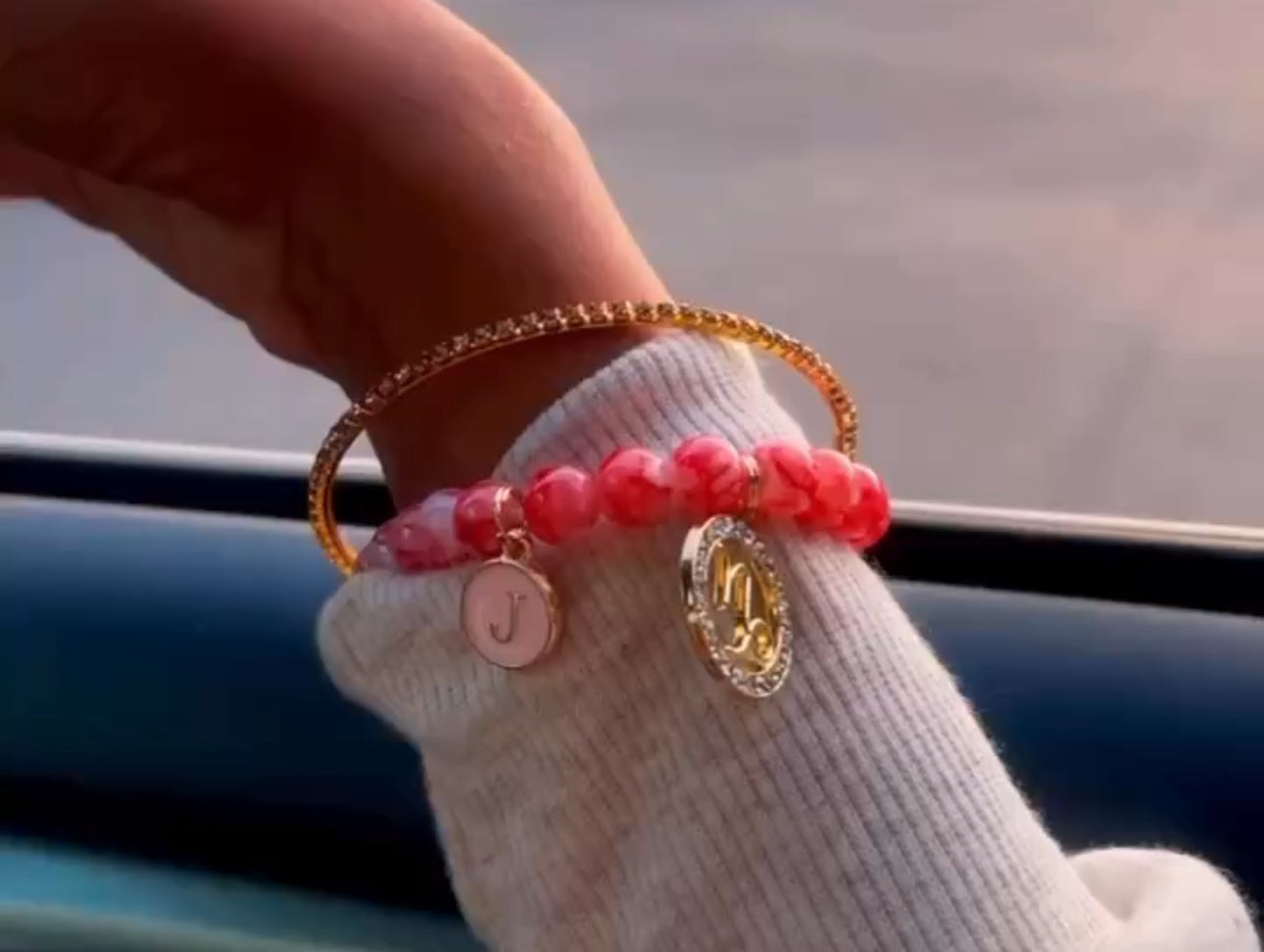 Pink bracelet with initials and zodiac sign